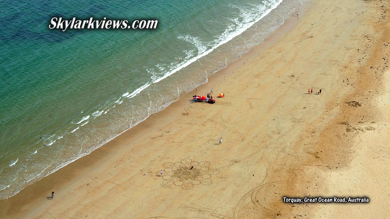 aerial view of people at sandy beach